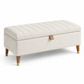 Panca contenitore in tessuto beige con gambe in legno